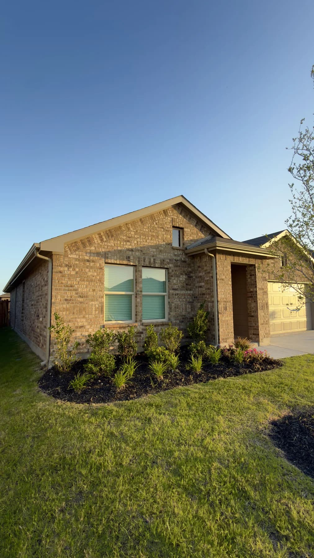 Bronze seamless gutters installed on a brick home